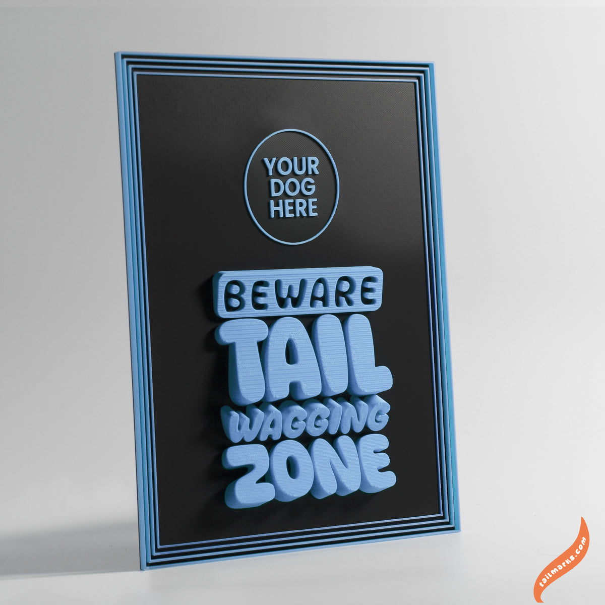Decorative sign with text 'Beware Tail Wagging Zone' with a focus frame on a black background
